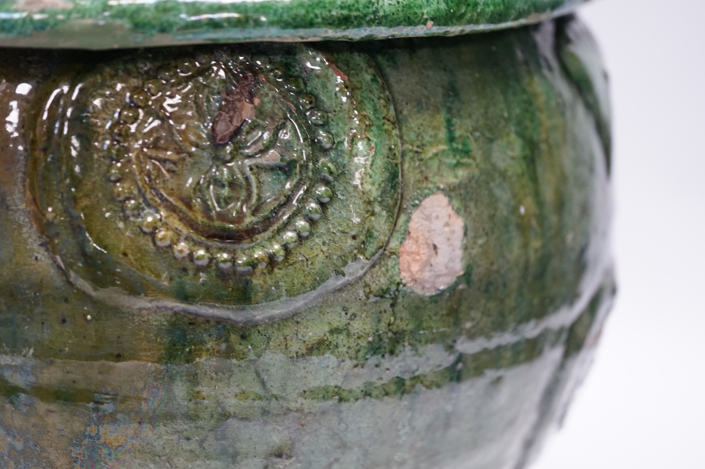 A Chinese Buddhist green glazed jar and cover, Song-Yuan dynasty, 33cm